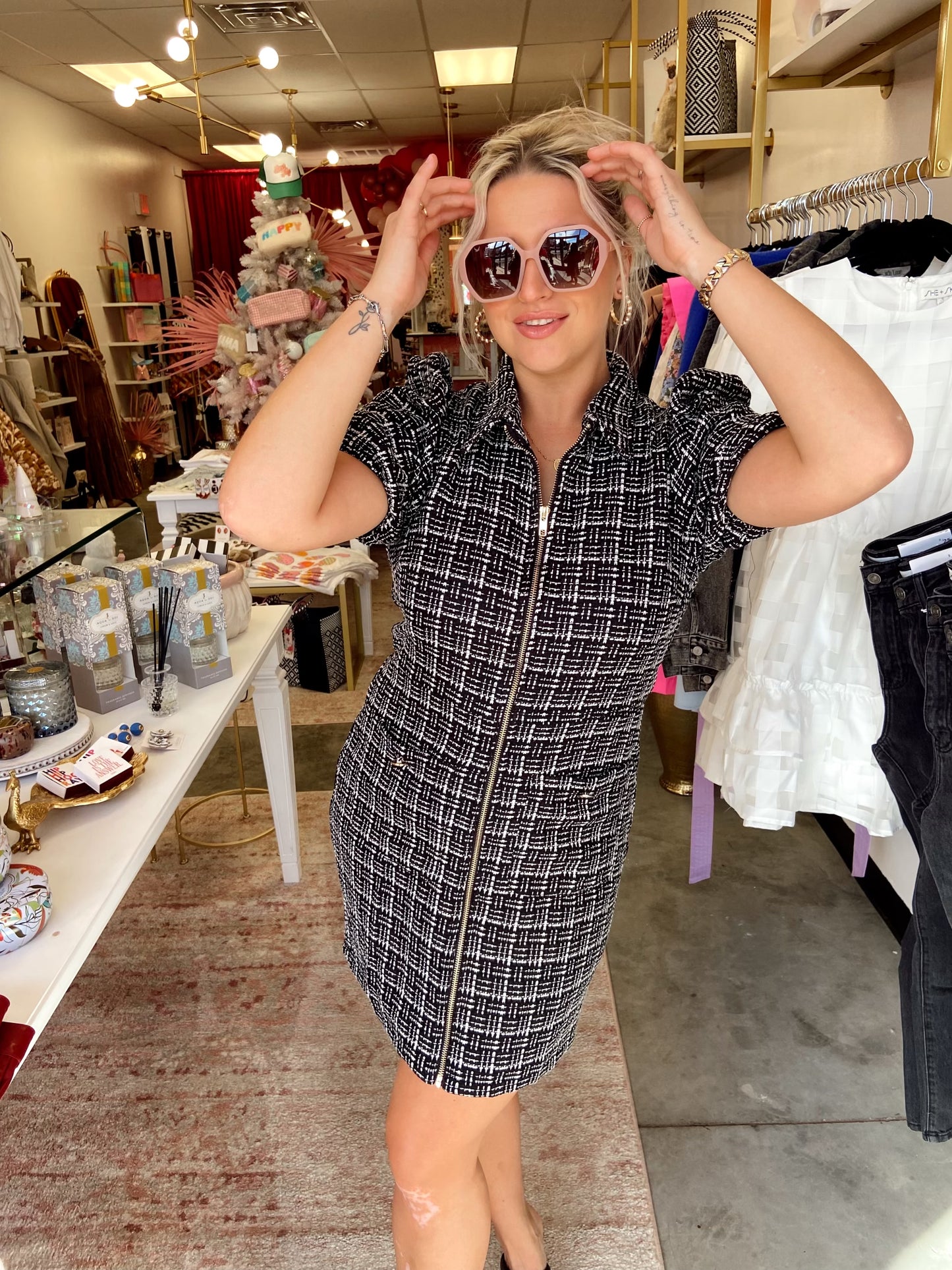 tweed fabric, collared neckline, puff sleeves, full zipper front, and front side pockets.
