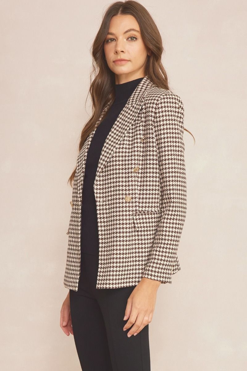 Take a risk in the All of a Sudden Jacket! This stylishly bold houndstooth blazer features button detailing, pockets, and inner lining, offering you the perfect combination of sophistication and comfort. Make an impact and face every challenge with confidence. Pair with the matching shorts to complete this set!