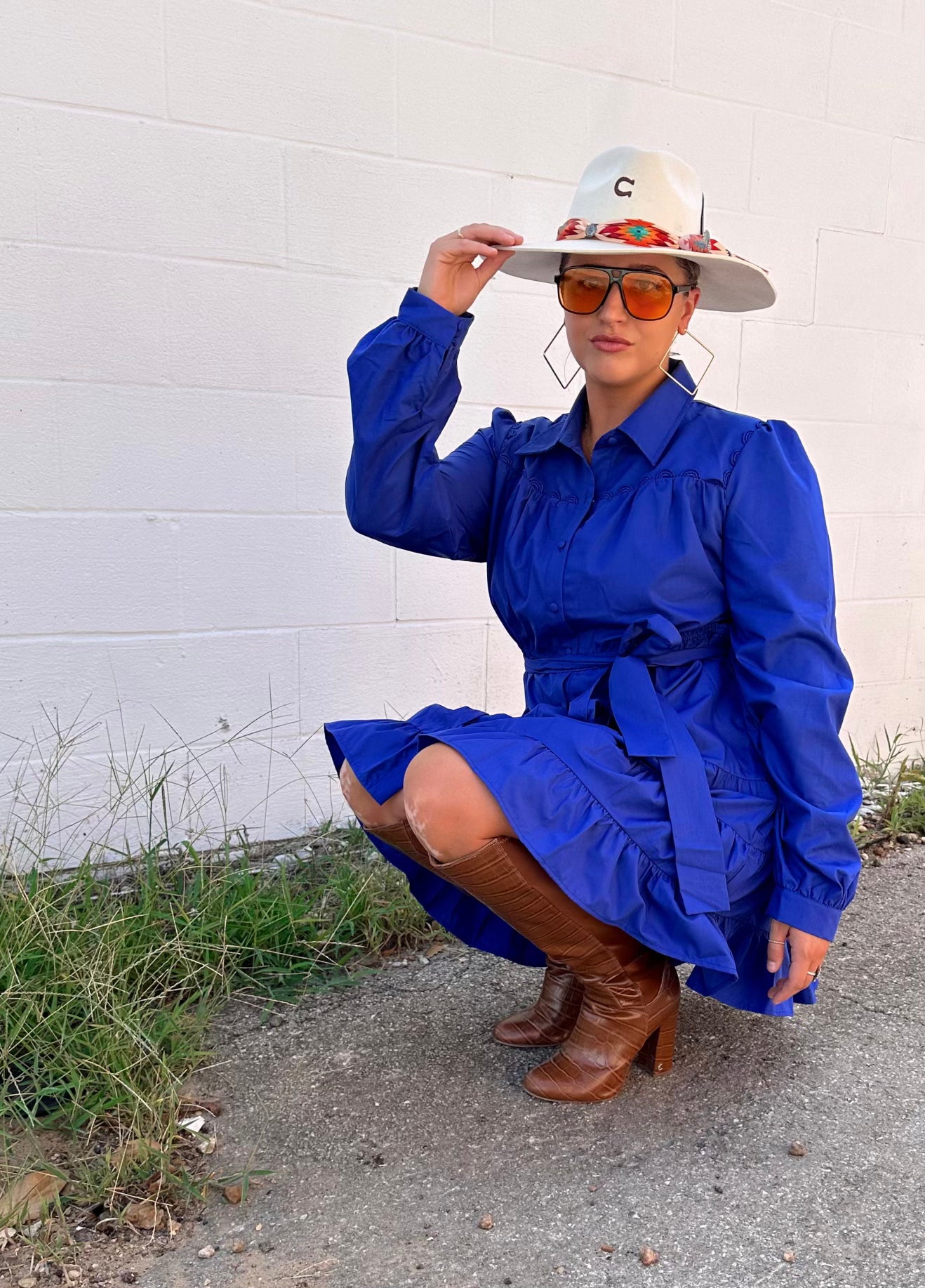 Poplin tiered mini dress -Shirring detail -Self-tie at waist -Belt loops -Collared -Button down -Cuff with button -Long balloon sleeve