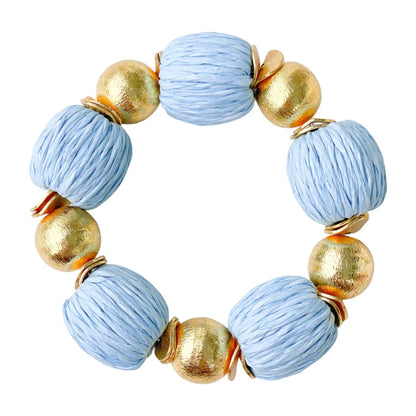 Elevate any outfit with these beautiful bracelets! They are made out of brushed gold plated copper beads and hand wrapped raffia beads.  7" long  Stretchy Elastic  14mm beads  Look great if you stack them!