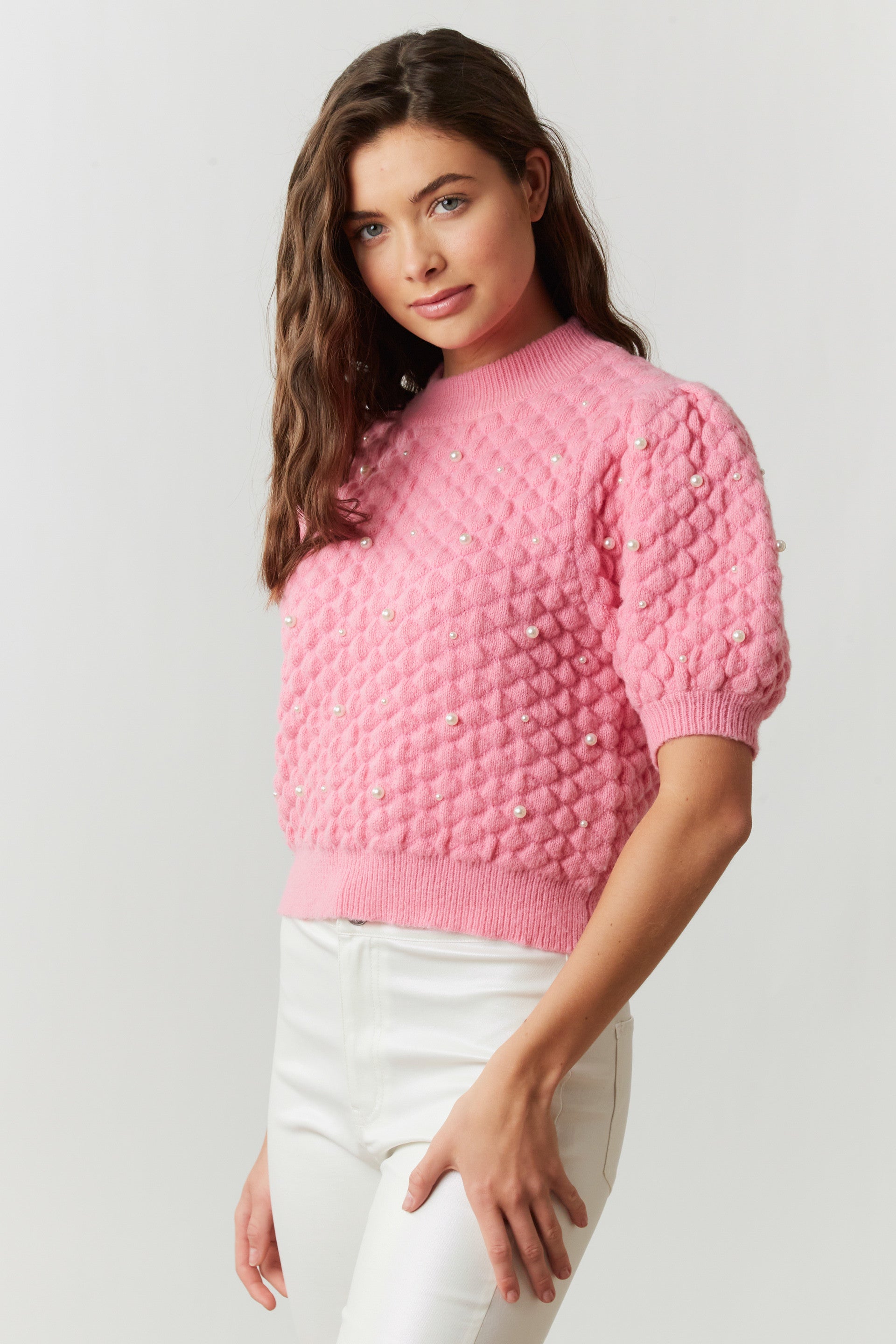 pink quilted sweater with pearl embellishments