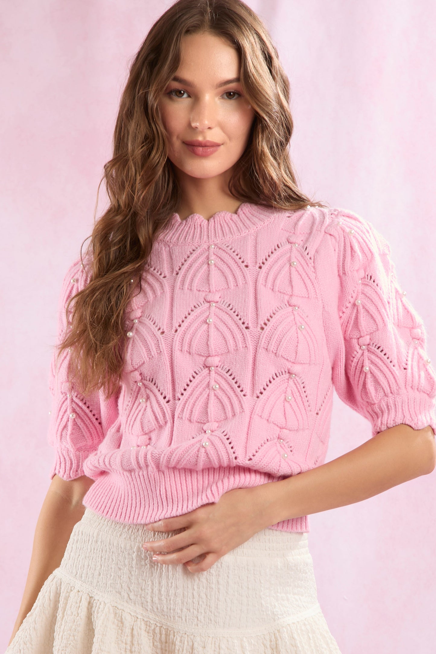 pink quilted sweater with pearl embellishments