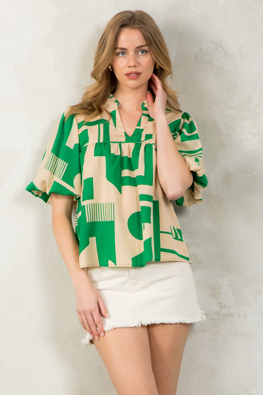 Get ready to turn heads with our Summertime Madness Top! Featuring fun puff sleeves and a playful print, this THML top is perfect for adding some quirky style to your summer wardrobe. Say goodbye to boring tops and hello to summertime fun with this must-have piece!