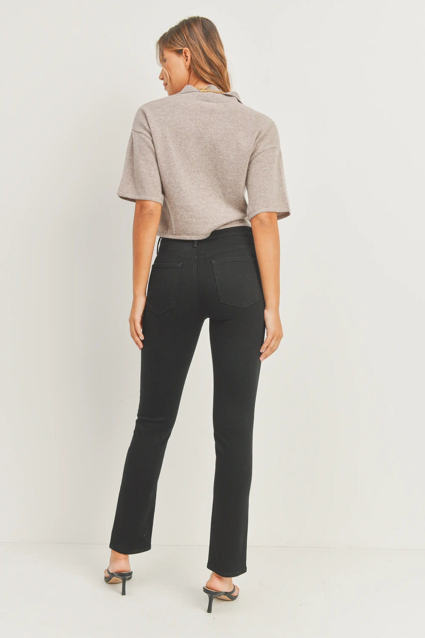Elevate your denim game with the JUST BLACK DENIM Mid Rise - Split Hem Slim Jeans. The mid rise design offers a flattering fit that sits comfortably on your hips, creating a sleek and modern silhouette that effortlessly complements your shape. 10.5" rise and a 30" inseam. The 7" split hem adds a dash of flair and timeless appeal. Pair these jeans with your favorite heels for an elevated look, or embrace a more laid-back vibe with sneakers or ankle boots.