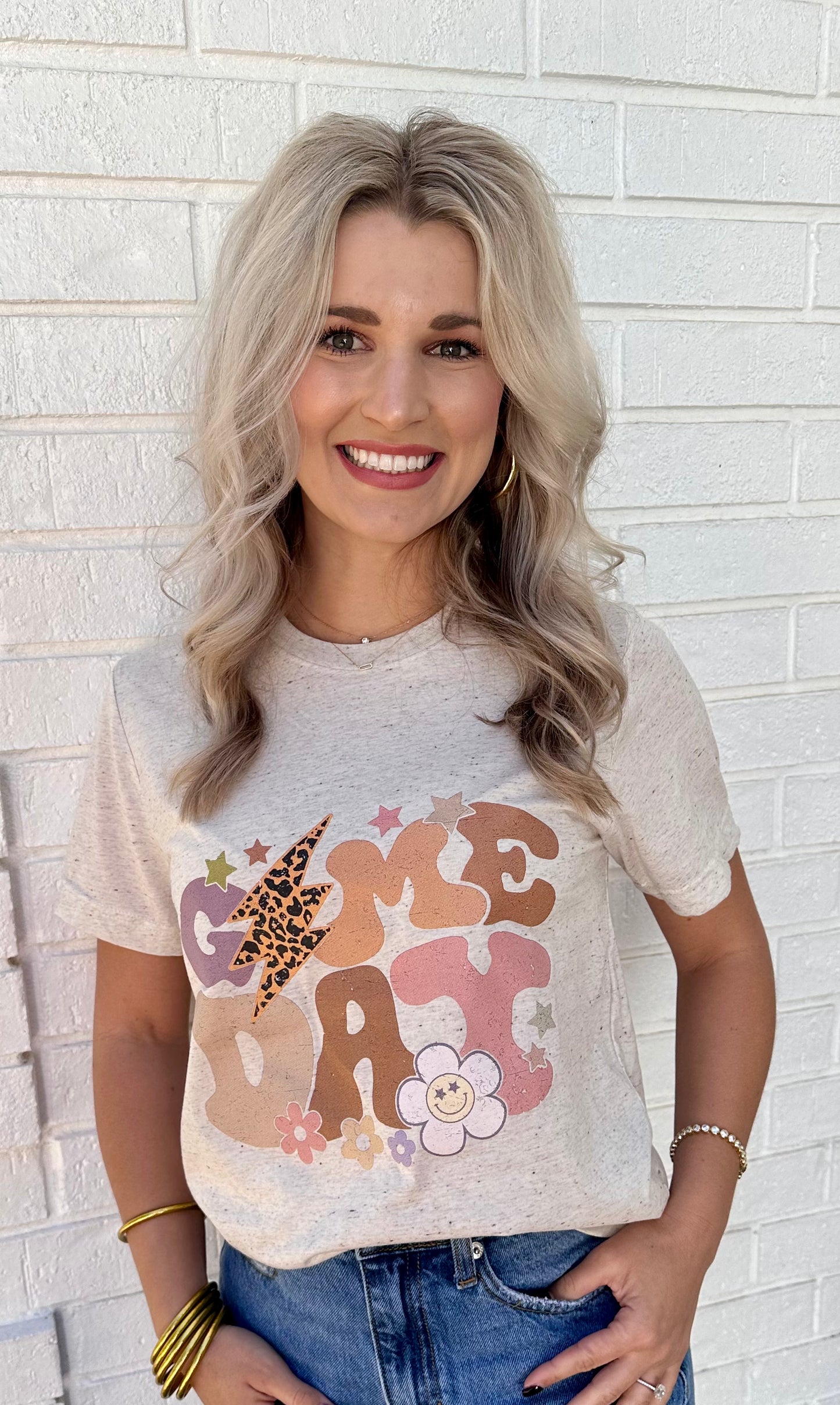 Game day t-shirt. Made from a premium tri-blend fabric, our tee combines the softness of cotton, the durability of polyester, and the stretch of rayon. It's a recipe for unmatched comfort that keeps you feeling great from kick-off to victory dance.