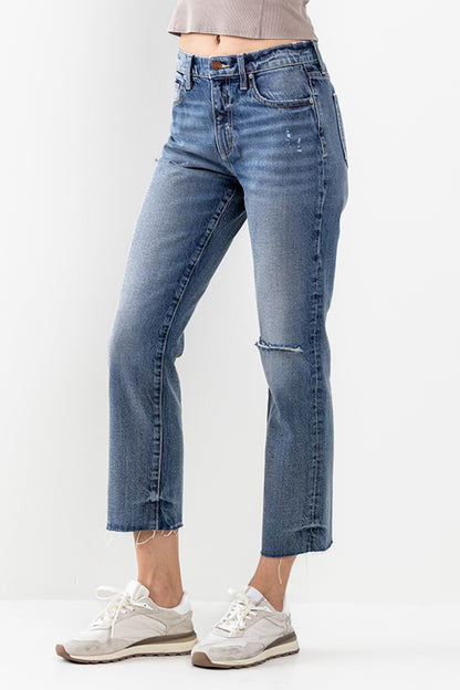 Everyone's Favorite Jeans. High rise straight jeans with distressed knee. Zipper front with button closure