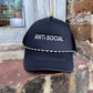 black trucker Hat, "Anti-Social" embroidery.