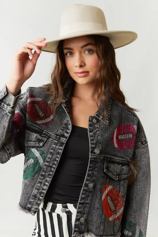 Elevate your game day style in our Game Day Jacket, a dazzling expression of team spirit. Rhinestone patches dazzle & catch the light, button-down closure ensures fit & layers. Pockets store essentials. Raw hem, cropped length adds edgy style. Perfect for a confident, fashion-forward look.