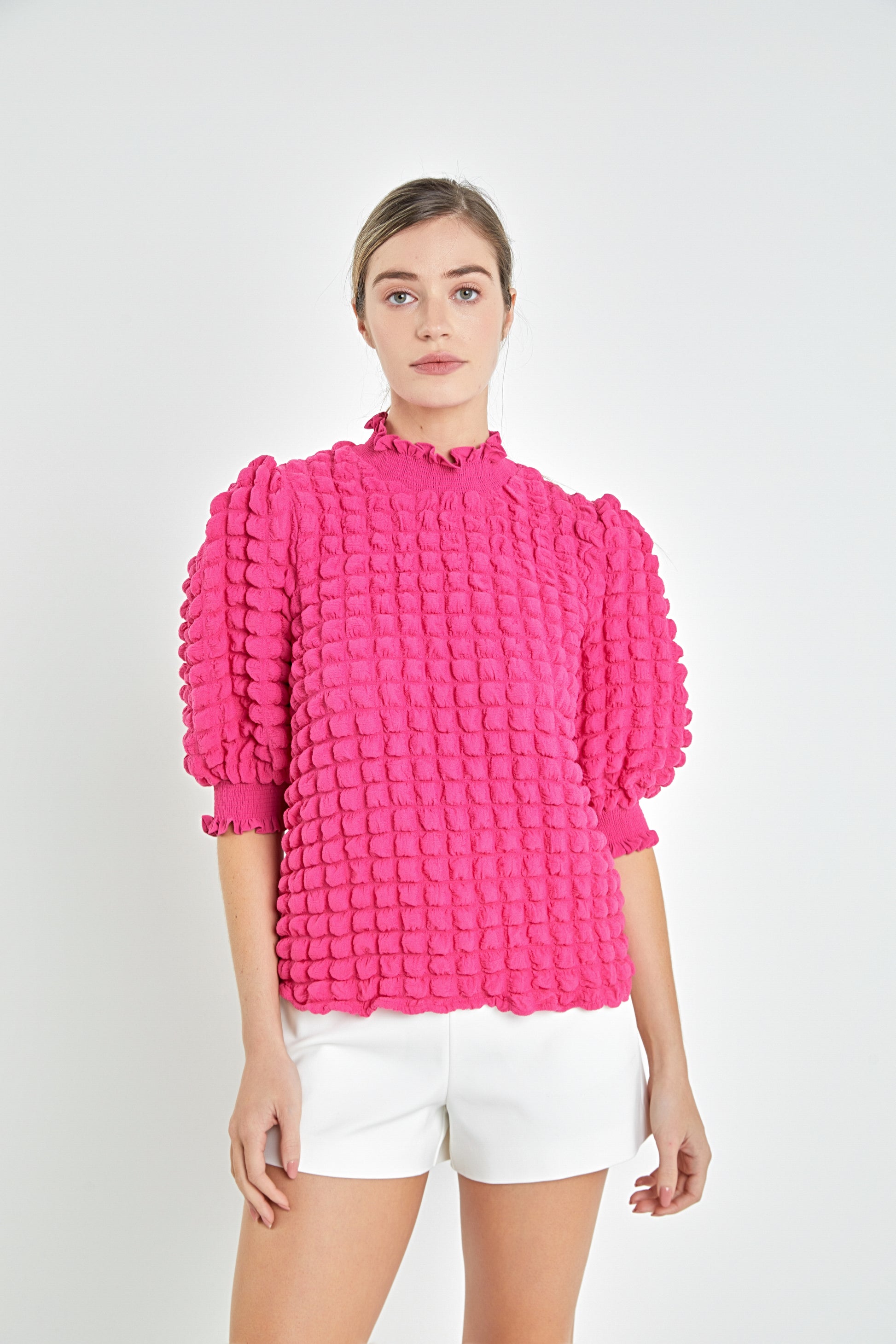 Get ready to stand out in the crowd with our XOXO Top! This hot pink, quilted textured top features playful puff sleeves for a fun and flirty look. Be bold and make a statement wherever you go!