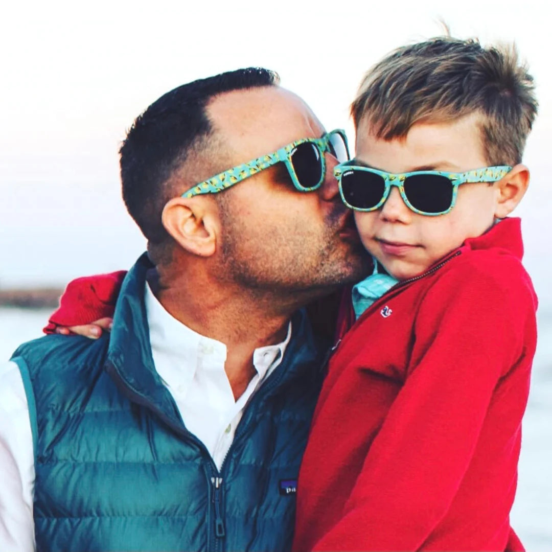 These wayfarer shades boast a fam-bam labor of love! My middle son & I designed this line, inspired by the owner of our local burger joint (aka Island Famous!). Pop art cheeseburgers in teal green? Check! Soft-touch, no-slip, polarized lenses? You bet! Island inspired by own very own special place, Galveston beach.