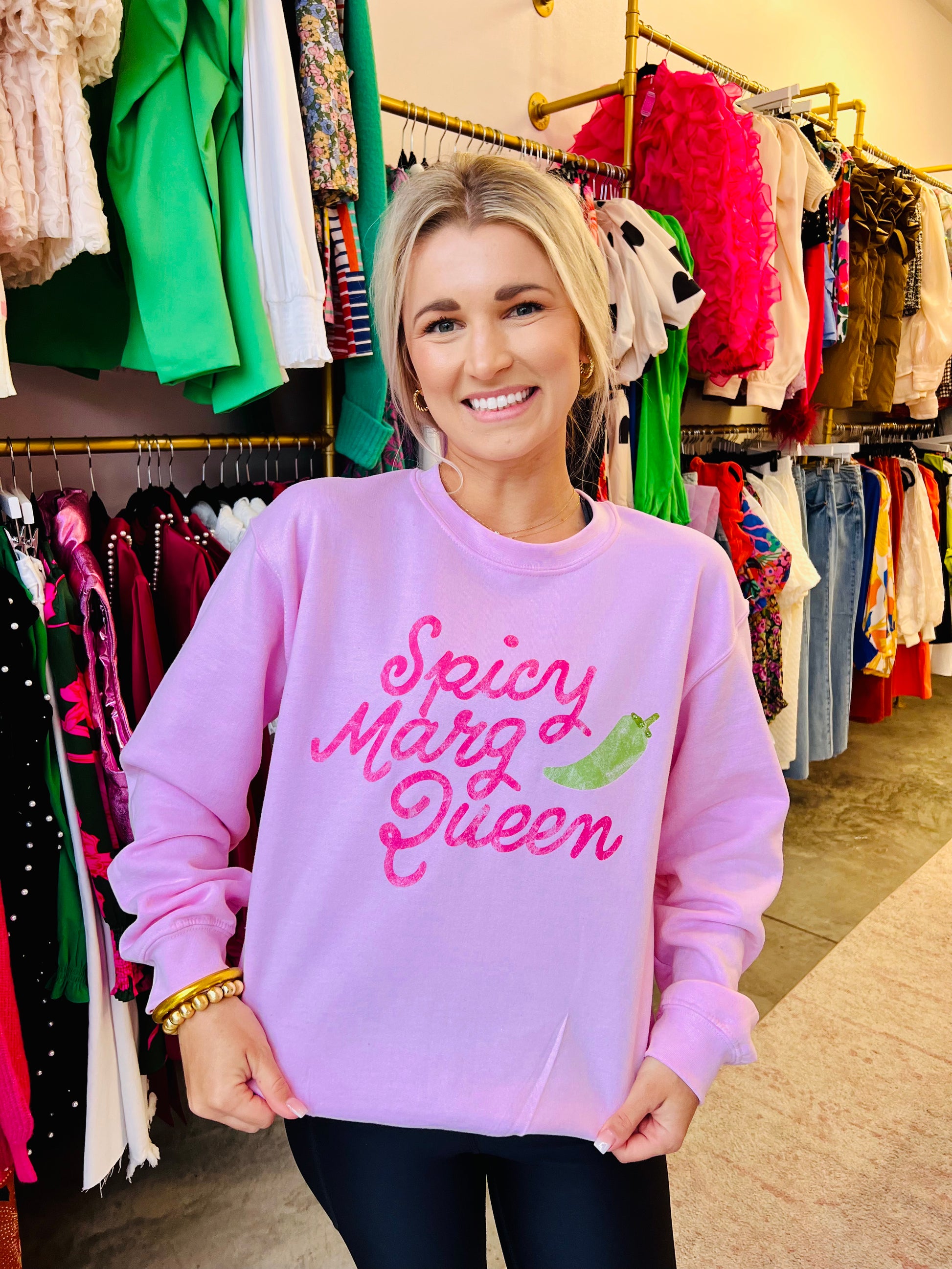 Be the queen of the cool kids with our Spicy Marg Queen sweater. This stylish sweatshirt will add some spice to your wardrobe and have you feeling like royalty. Perfect for casual GNO!