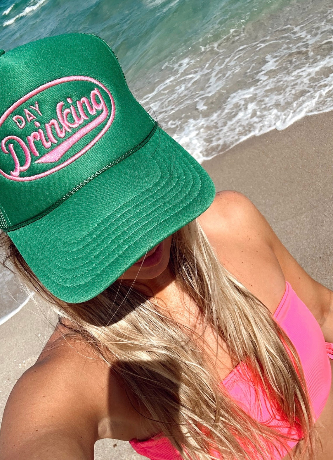 Get ready to kick back and relax with our Support Day Drinking Trucker Hat! This green trucker hat with pink embroidery is the perfect accessory for sipping cocktails by the pool. Embrace the fun and carefree spirit of day drinking while looking stylish and supporting the cause. Cheers to that!