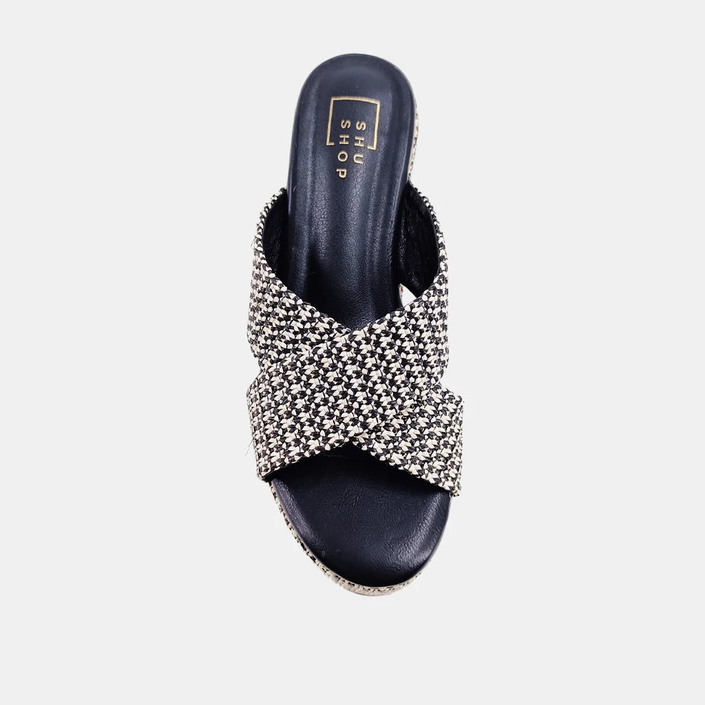 Our IMELDA wedges are an exquisite piece of footwear that will transport you to the past with their inspiration drawn from the iconic clogs that have stood the test of time. The pair is crafted from a blend of luxuriously soft textiles, which provide a comfortable and snug fit. These versatile wedges can be paired with anything from denim to dresses, making them an essential addition to your spring/summer collection.