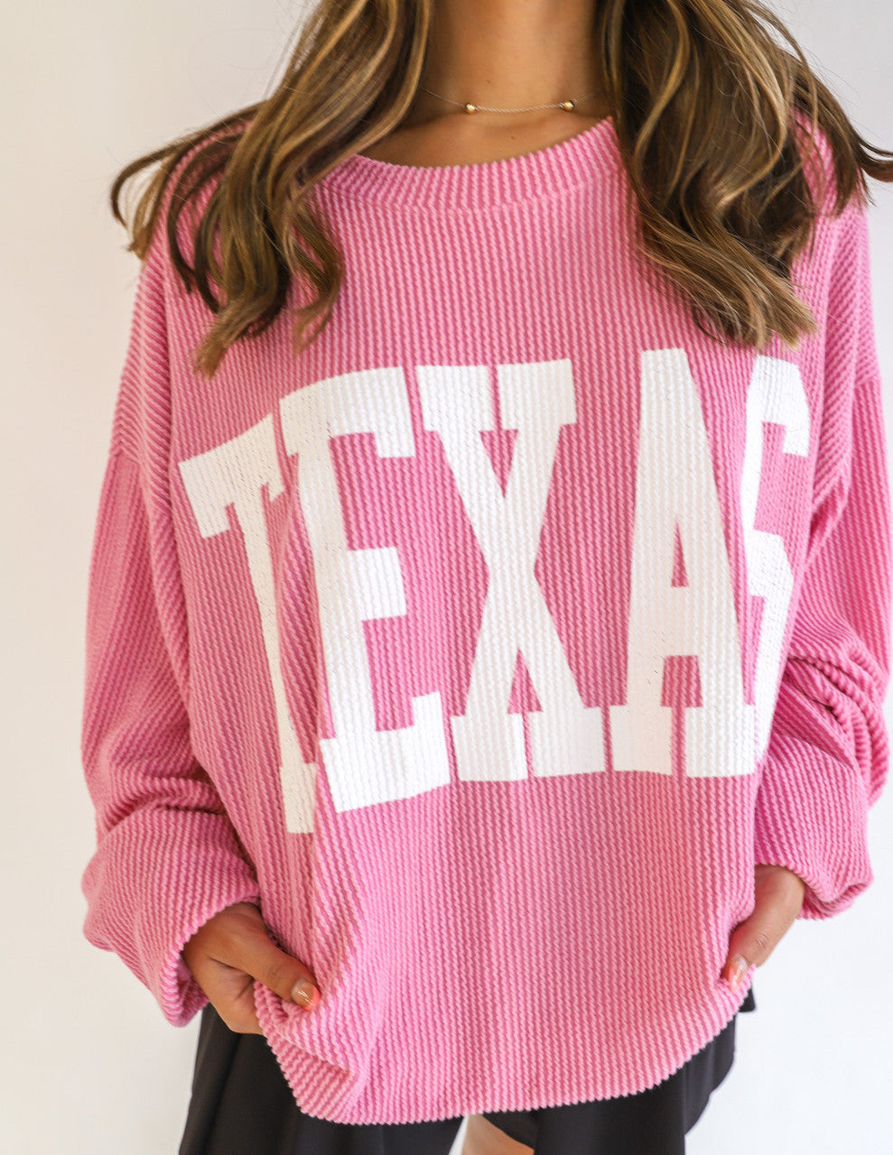 Feel the warmth of Texas with the TX Time Sweater. This cozy graphic sweatshirt features a crew neck, long drop-shoulder sleeves and corded fabric for a supremely comfortable fit. Make Texas proud and show your style with this stylish and comfortable pullover.