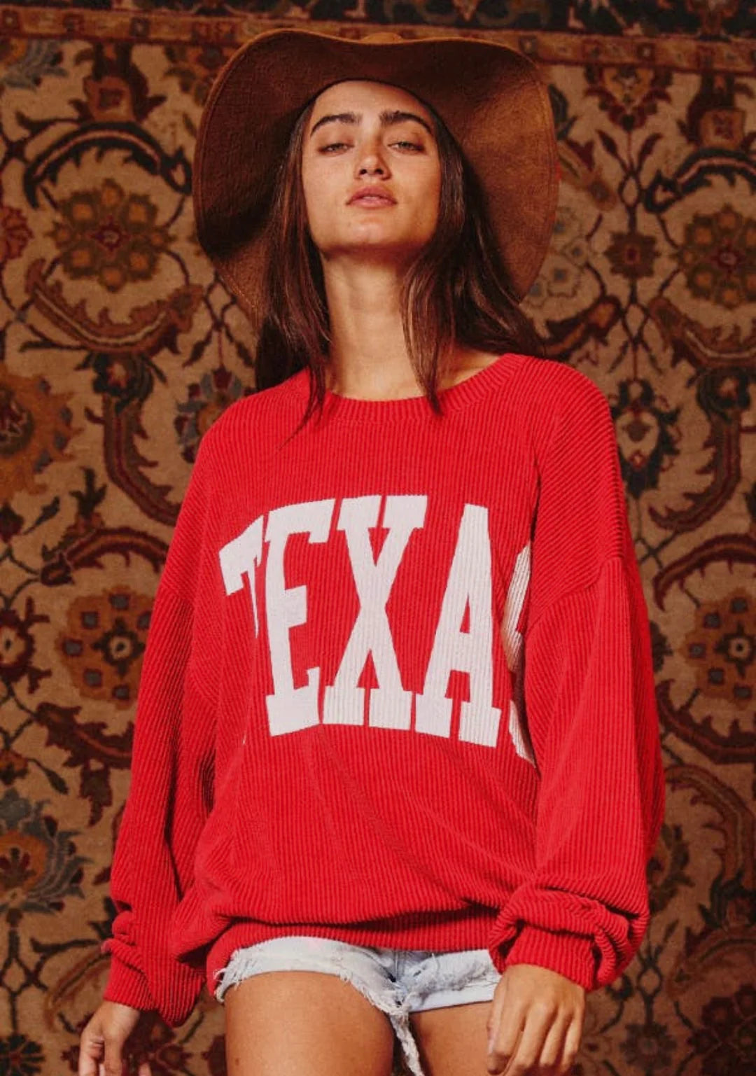 cozy graphic sweatshirt features a crew neck, long drop-shoulder sleeves and corded fabric for a supremely comfortable fit. Red "Texas" Sweater