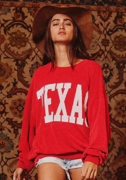 cozy graphic sweatshirt features a crew neck, long drop-shoulder sleeves and corded fabric for a supremely comfortable fit. Red "Texas" Sweater