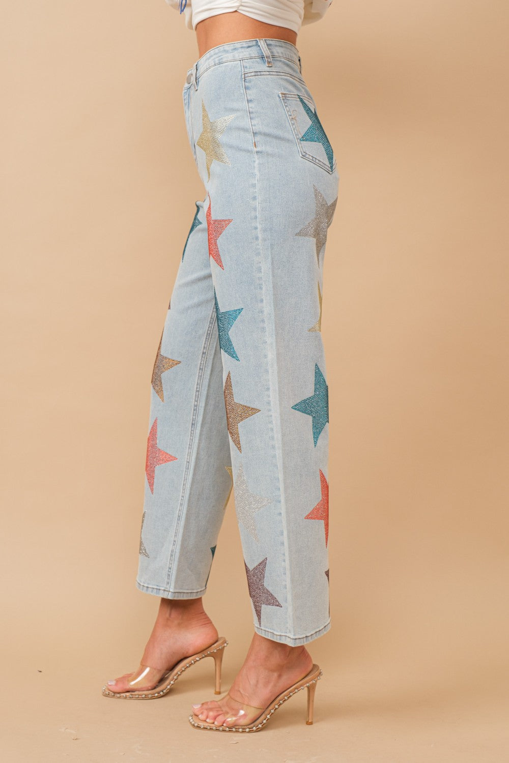 high-quality denim, these straight-leg jeans are adorned with multi-colored stars,