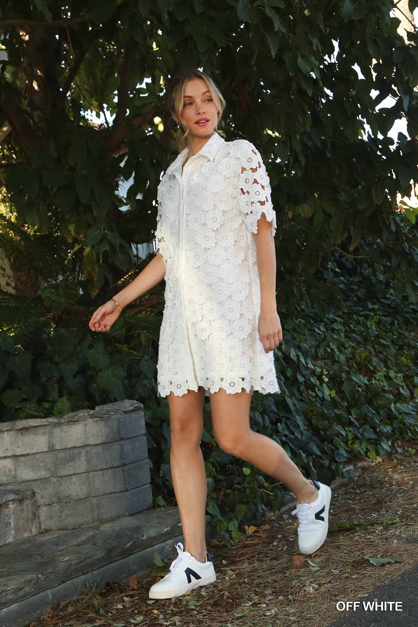 Get ready to bloom with the Flower Power Dress! This playful dress features a charming floral lace design and a button down front, perfect for a fun and flirty look. Embrace your inner flower child and stand out in this quirky and stylish dress.