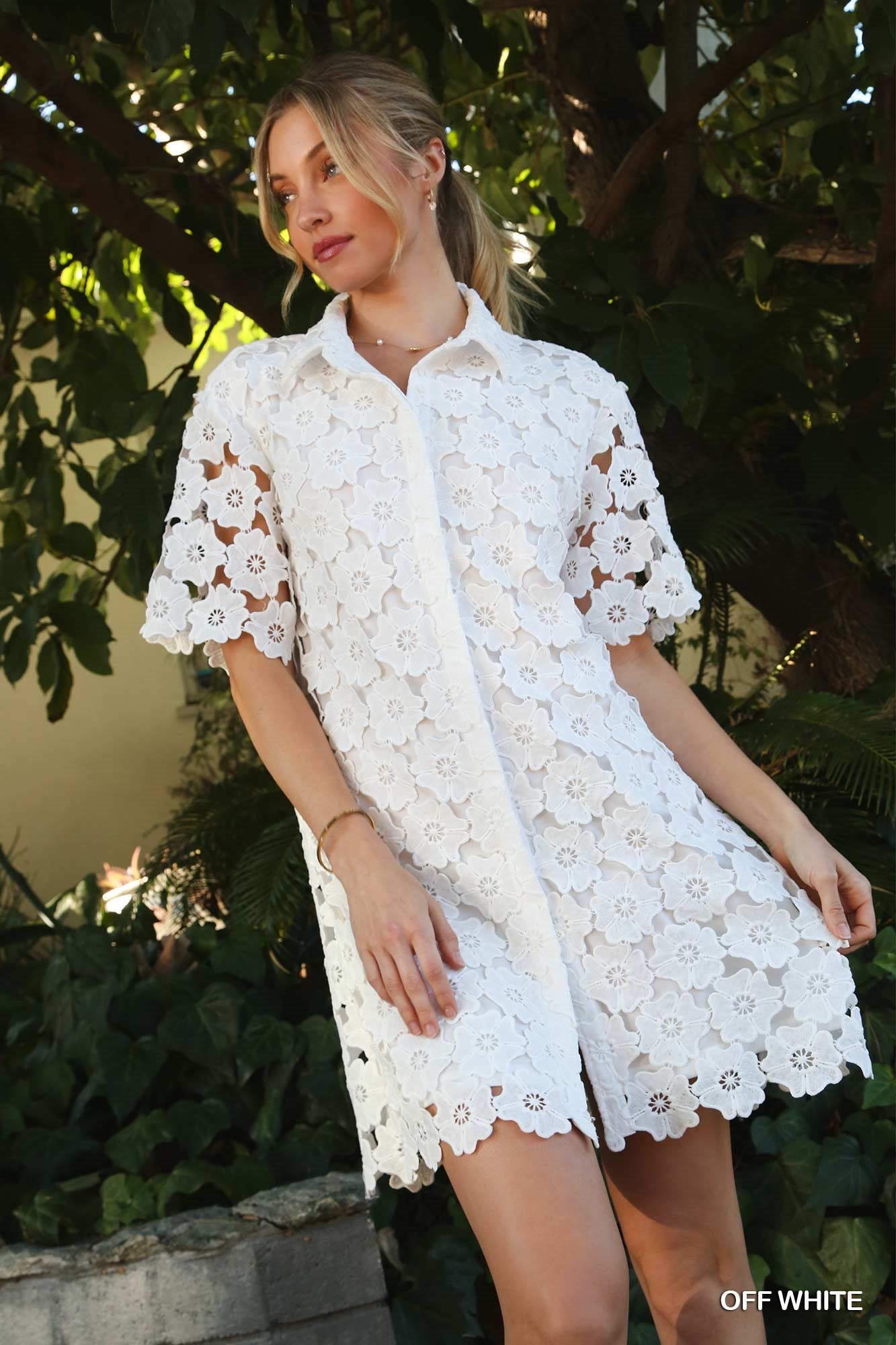 Get ready to bloom with the Flower Power Dress! This playful dress features a charming floral lace design and a button down front, perfect for a fun and flirty look. Embrace your inner flower child and stand out in this quirky and stylish dress.