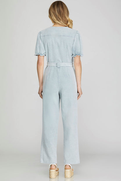 Get ready to soar in the Blue Skies Jumpsuit! Combining comfort and style, this jumpsuit features a puffed sleeve, v-neck, and waist tie for a flattering fit. With a convenient zip-up design and practical side pockets, you'll never want to take off this woven jumpsuit. Perfect for any occasion.