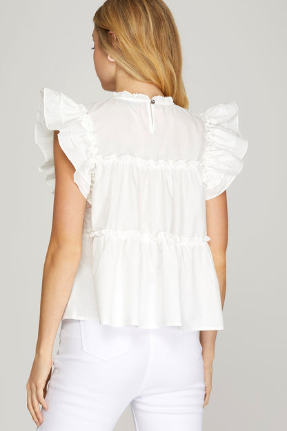Take a peek at this Loving Glance Top! With its flutter sleeves and tiered woven fabric, it's flirty and fun. Perfect for a casual date or a night out with friends.