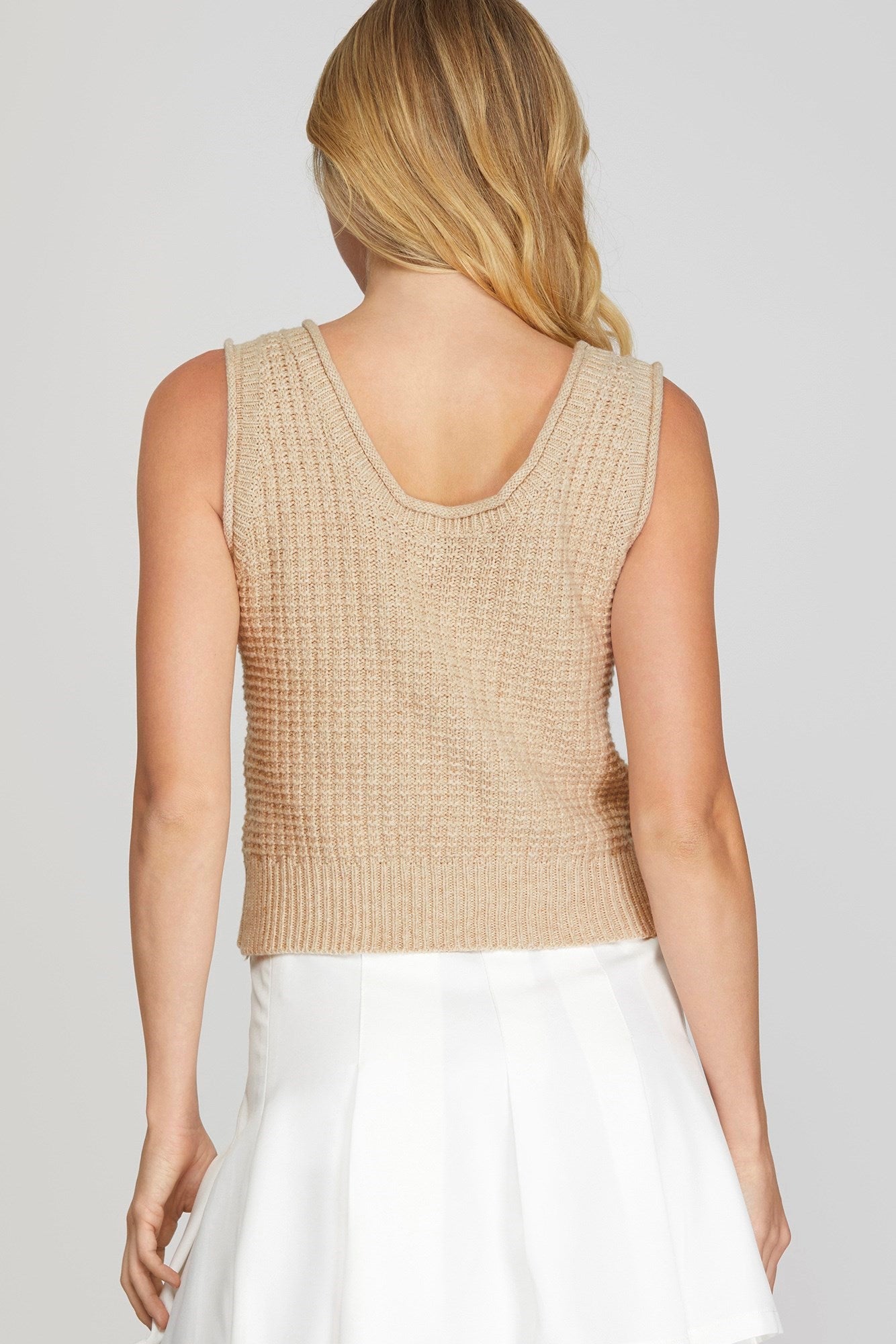 Get ready for sunny days with this sleeveless textured sweater top! Perfect as a layering piece, this top will keep you cool and stylish. Don't let the name fool you, this top is versatile enough to wear year-round.
