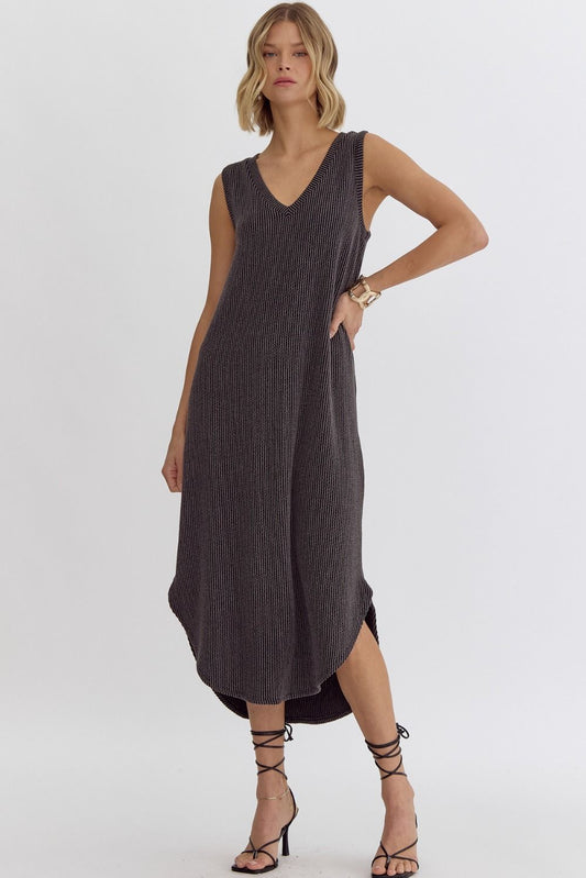 Introducing the Hit Pause Dress - a must-have for any fashion-forward individual! This solid ribbed v-neck sleeveless midi dress features a unique round hem detail, making it a standout piece in your wardrobe. The lightweight, knit fabric is non-sheer and unlined, ensuring ultimate comfort and versatility. Hit pause on your busy schedule and unwind in style with this stunning dress!