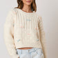 Introducing the Bow Era Sweater - the perfect combination of comfort and style with its soft velvet ribbon and long sleeves. Get ready to add a touch of elegance to your wardrobe!