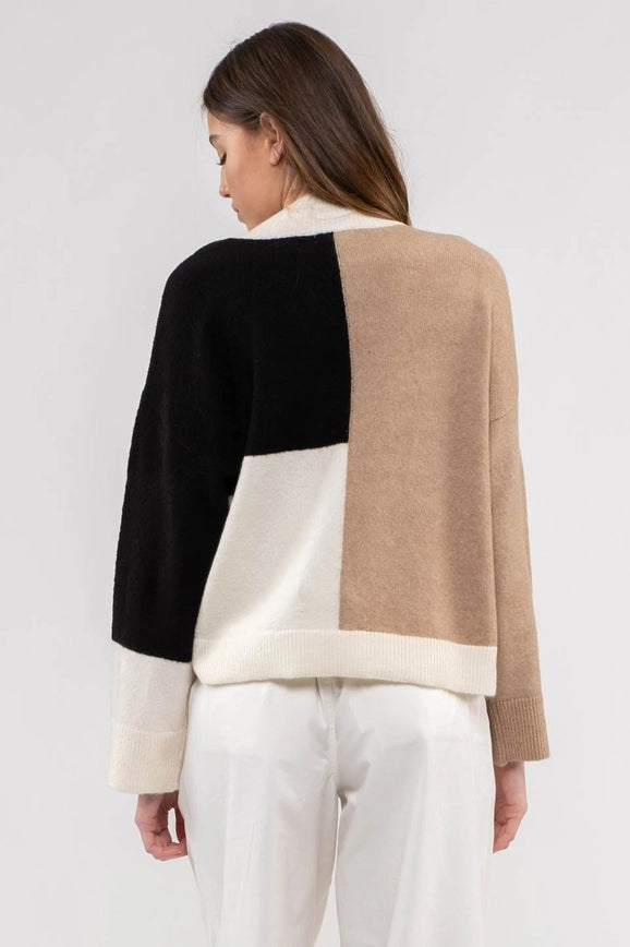 Be the life of the party in the Fireside Sweater! This colorblock delight is the perfect lightweight sweater for any occasion—who doesn't love a sweater that goes with everything? Get cozy in style this season!