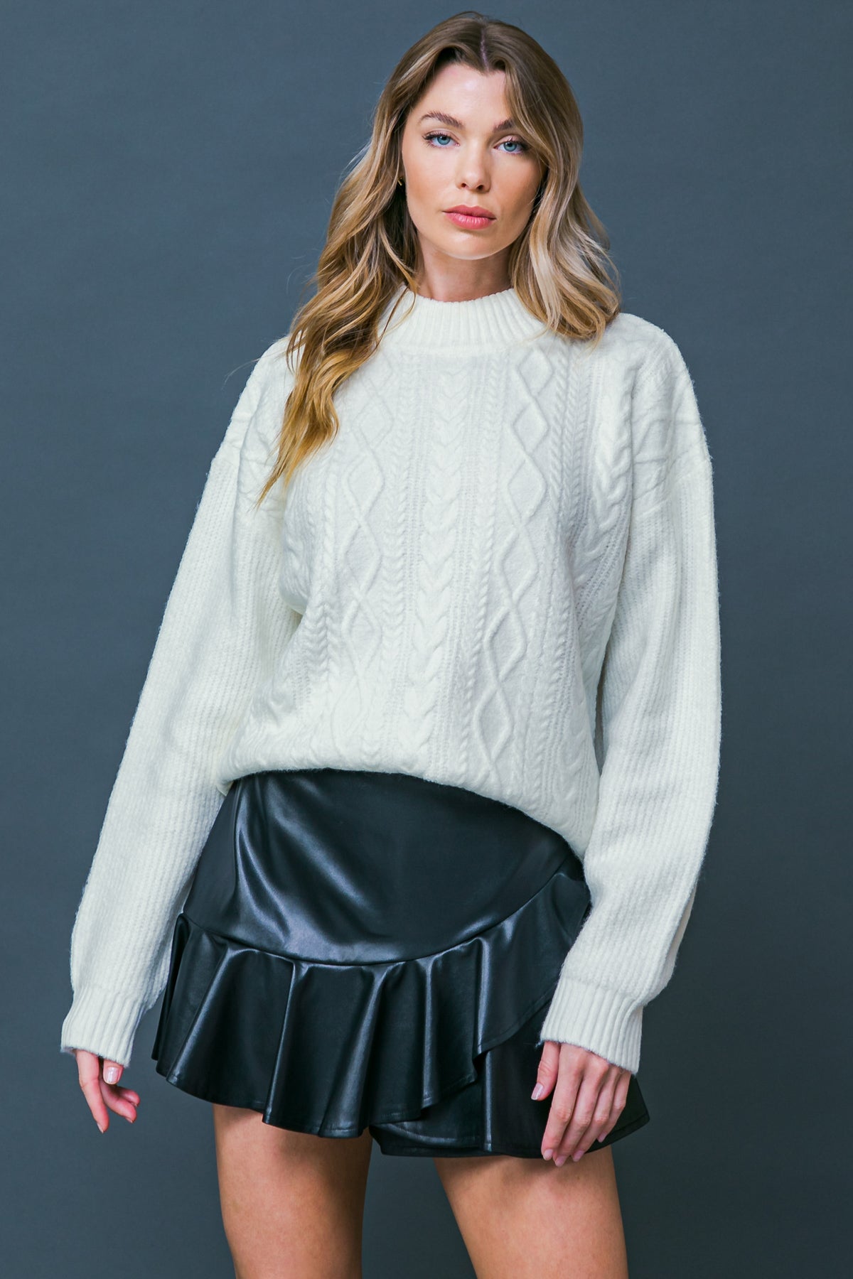 Make your fairytale dreams come true with this Snow White inspired knit. With a mock neck, long sleeve, and relaxed body, this sweater will have you feeling cozy and cute! 
