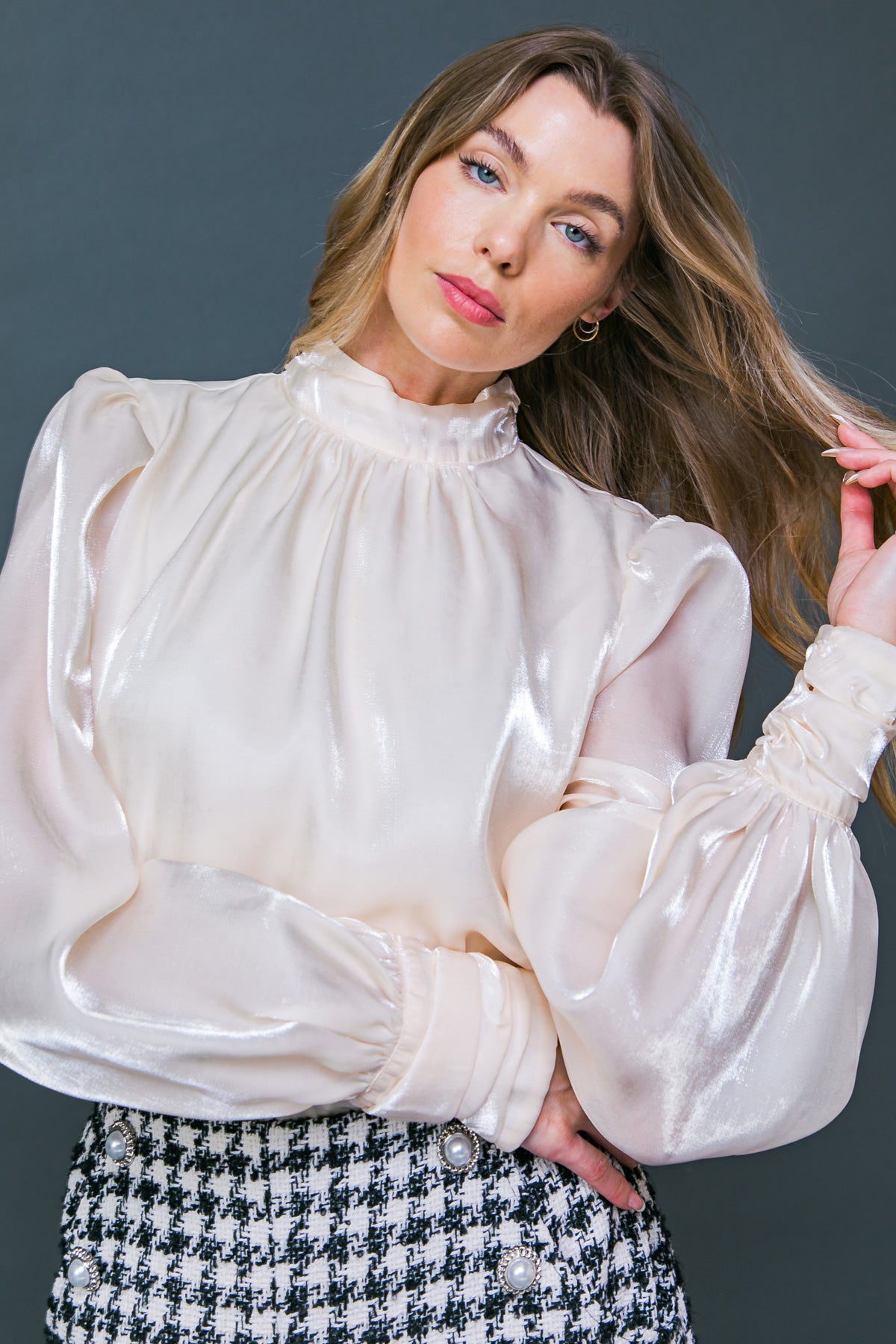 Look classy and chic in our Stay Sophisticated Top! This sophisticated top features a high neckline, long puff sleeves, and a back neck button closure, making it the perfect way to amp up a work outfit. Dress it up with a statement necklace to feel fierce and fabulous!