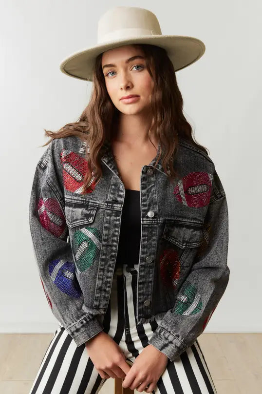 Elevate your game day style in our Game Day Jacket, a dazzling expression of team spirit. Rhinestone patches dazzle & catch the light, button-down closure ensures fit & layers. Pockets store essentials. Raw hem, cropped length adds edgy style. Perfect for a confident, fashion-forward look.