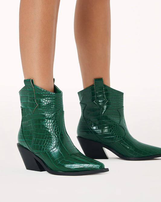 Ulira by Billini is a cowboy ankle boot.  Dress it up or down in this classic cowboy boot.  Featuring;  mid block heel high cut ankle boot upper squared off pointed toe large side pull tabs western inspired cut-out design synthetic upper, lining and outsole