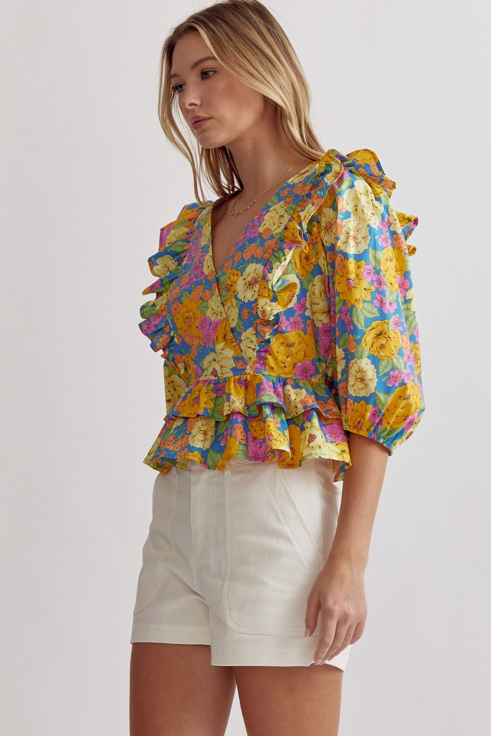 Unleash your inner fashionista with our floral print v-neck peplum top! The stylish 3/4 sleeves and ruffle detail add a touch of femininity while the snap button closure provides convenience. This lightweight and non-sheer top is perfect for any occasion - from casual gatherings to dressy events!