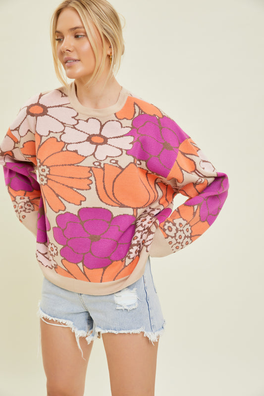 Look cool and beat the chill with this Flower Power Sweater! Show off your retro-inspired style with its festive floral design and cozy long sleeves - the perfect addition to any outfit. Get ready to bloom!
