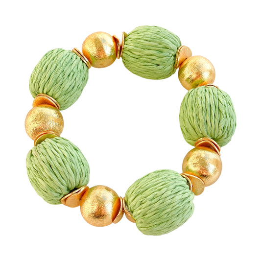 Elevate any outfit with these beautiful bracelets! They are made out of brushed gold plated copper beads and hand wrapped raffia beads.  7" long  Stretchy Elastic  14mm beads  Look great if you stack them!
