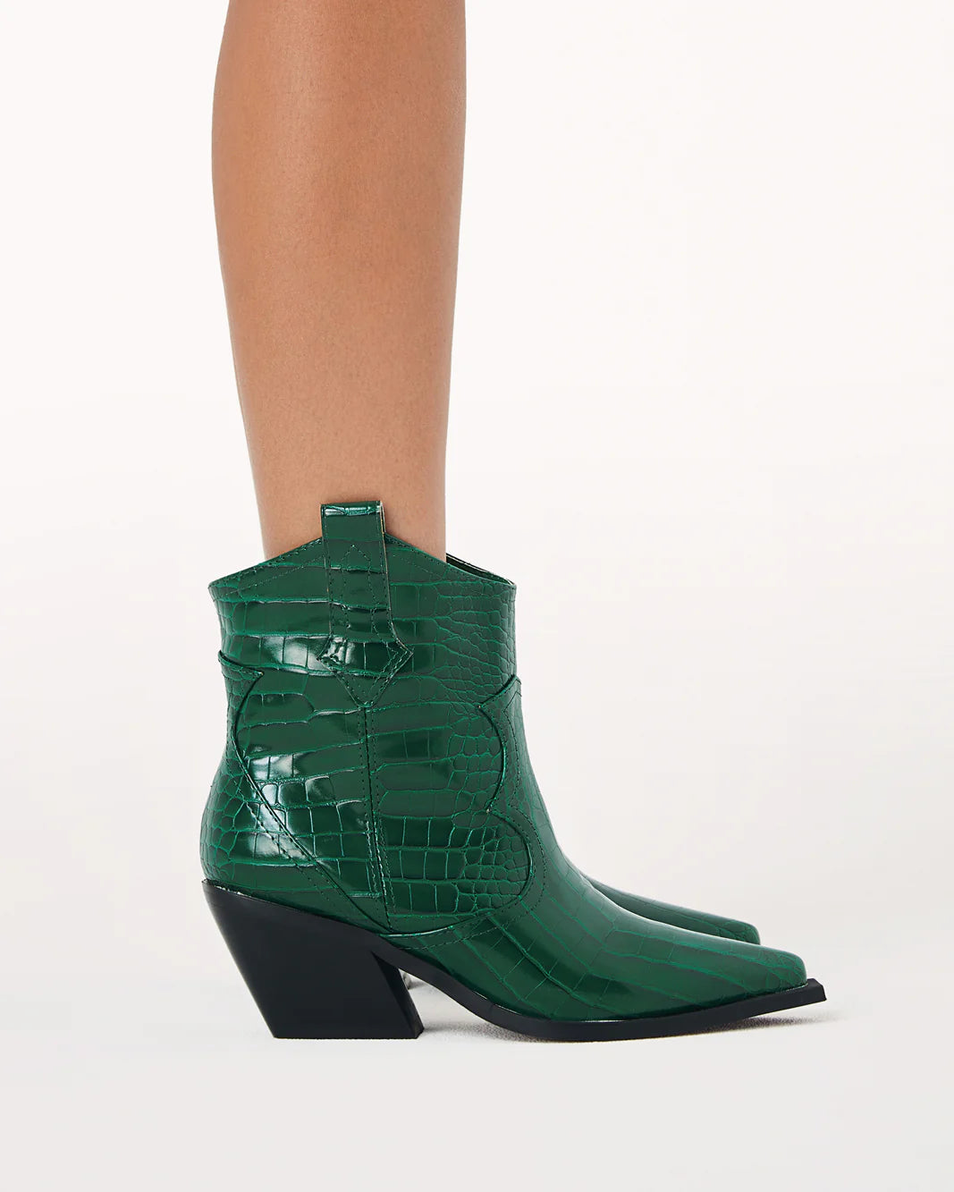 Ulira by Billini is a cowboy ankle boot.  Dress it up or down in this classic cowboy boot.  Featuring;  mid block heel high cut ankle boot upper squared off pointed toe large side pull tabs western inspired cut-out design synthetic upper, lining and outsole