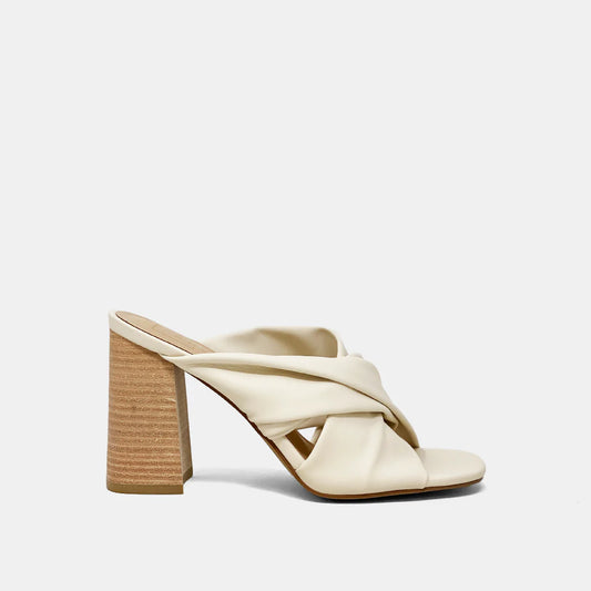 Crafted from soft faux leather, our FIJI slip-on sandal is a timeless silhouette updated with contemporary details, like its drpaed upper and stacked chunky heel. Wear yours with wide jeans or tailored pants.