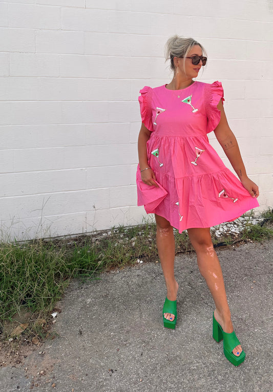 Sequin martini patch mini dress, ruffled flutter sleeves, back zipper closure. Hands down the best happy hour dress there is! Nothing says "celebrate" quite like a dress that sparkles as bright as champagne! Slip it on and show off your style with this one-of-a-kind look.