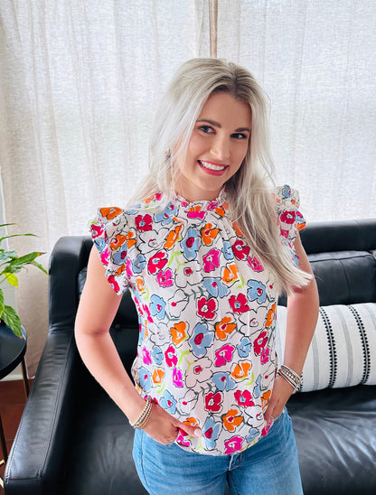 Lovely Me top. THML top. The BEST everyday top there is for SPRING!! This floral printed top is light-weight with ruffle sleeves. 