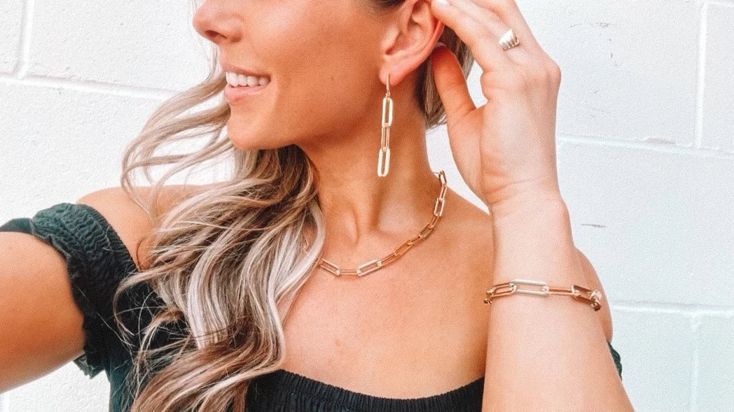 Link Gold Earrings are so hot right now! Exquisitely crafted with non-tarnishing 24kt gold plating these earrings are designed for lasting elegance. Hypoallergenic and water-resistant, they measure 2" long. 