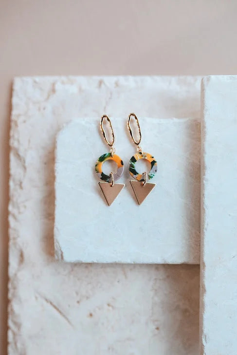 These stunning Tropical Earrings are perfect for your next vacation, or just for your next night out. Expertly crafted with non-tarnishing 24kt gold plating and acrylic these earrings are designed for to make a lasting statement. Hypoallergenic and water-resistant, they measure 1.5" long.