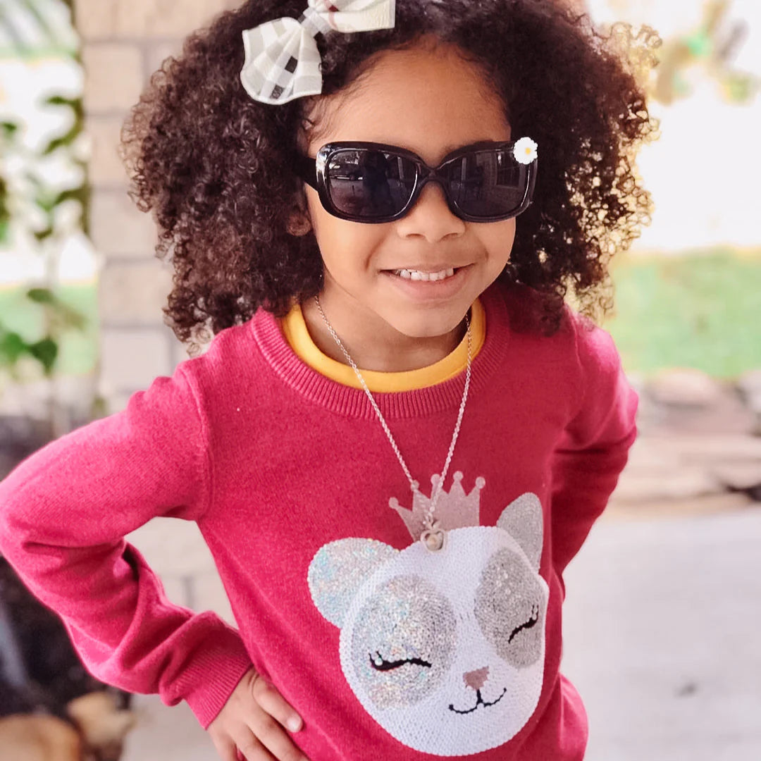 These glossy, black sunglasses feature polarized lenses and still very fashionable. Mommy and me! Make summer-time memories in style! With UV-protective lenses, you can rest assured that your little one's eyes are safe. Plus, they'll look oh-so-cute!