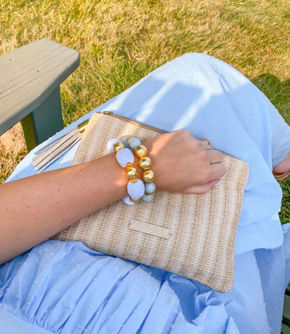 Elevate any outfit with these beautiful bracelets! They are made out of brushed gold plated copper beads and hand wrapped raffia beads.  7" long  Stretchy Elastic  14mm beads  Look great if you stack them!