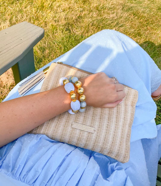 Elevate any outfit with these beautiful bracelets! They are made out of brushed gold plated copper beads and hand wrapped raffia beads.  7" long  Stretchy Elastic  14mm beads  Look great if you stack them!