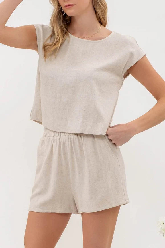 Get ready to party in our Summertime Party Top! Made with a linen blend, this round neck top will keep you cool and stylish all day and night. Pair with matching shorts to complete the set. Perfect for any summer gathering. Let's get this party started!