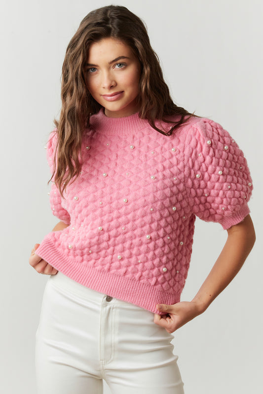 pink quilted sweater with pearl embellishments