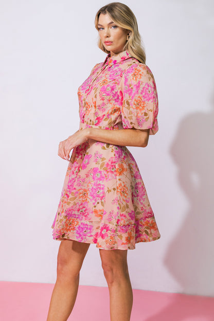 Unleash your playful side with this printed woven mini dress! Featuring a stylish shirt collar and functional button down, this dress is both trendy and practical. The short puff sleeves add a touch of femininity, while the full skirt and side zipper closure ensure a perfect fit. Get ready to turn heads and make a statement in this unique and fun dress!