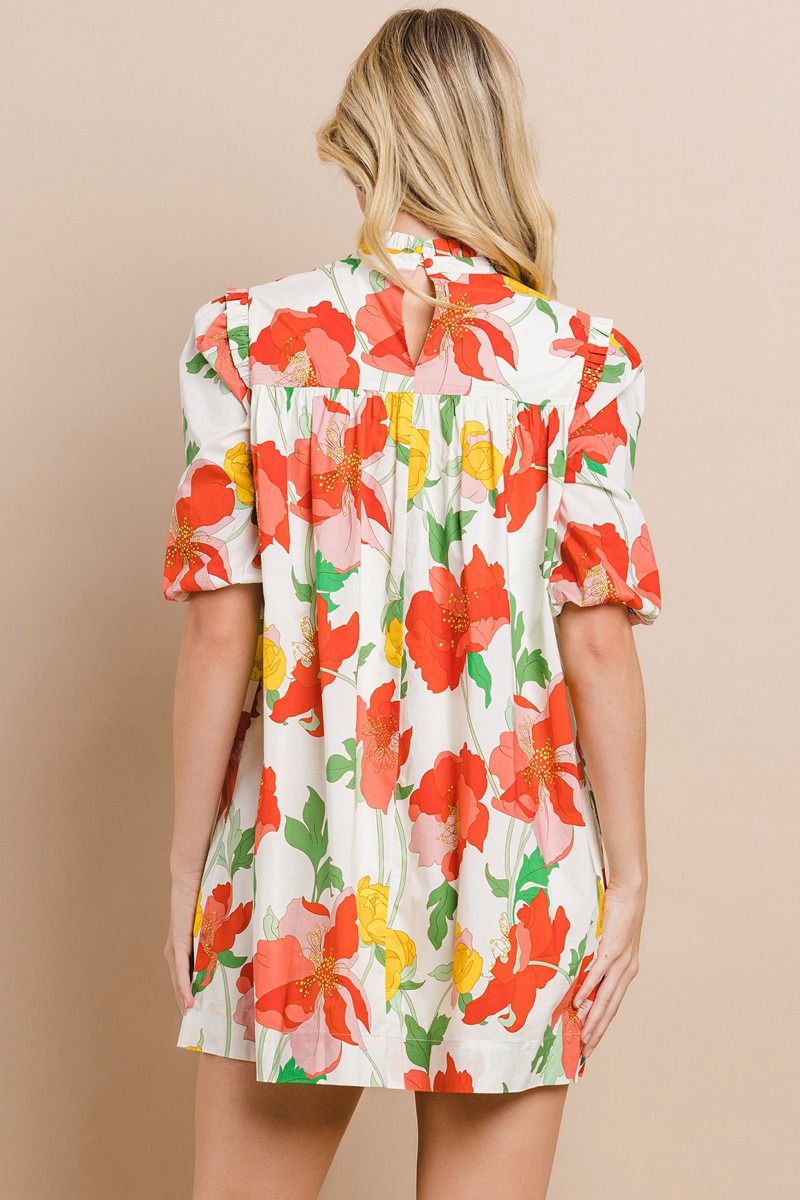 Make a statement with the playful and stylish Sunshine Forever Dress. This floral printed shift dress features a ruffled mock neck and pleated detailing, along with half puff sleeves and a back buttoned keyhole for added flair. Stay ahead of the fashion game with this must-have dress!