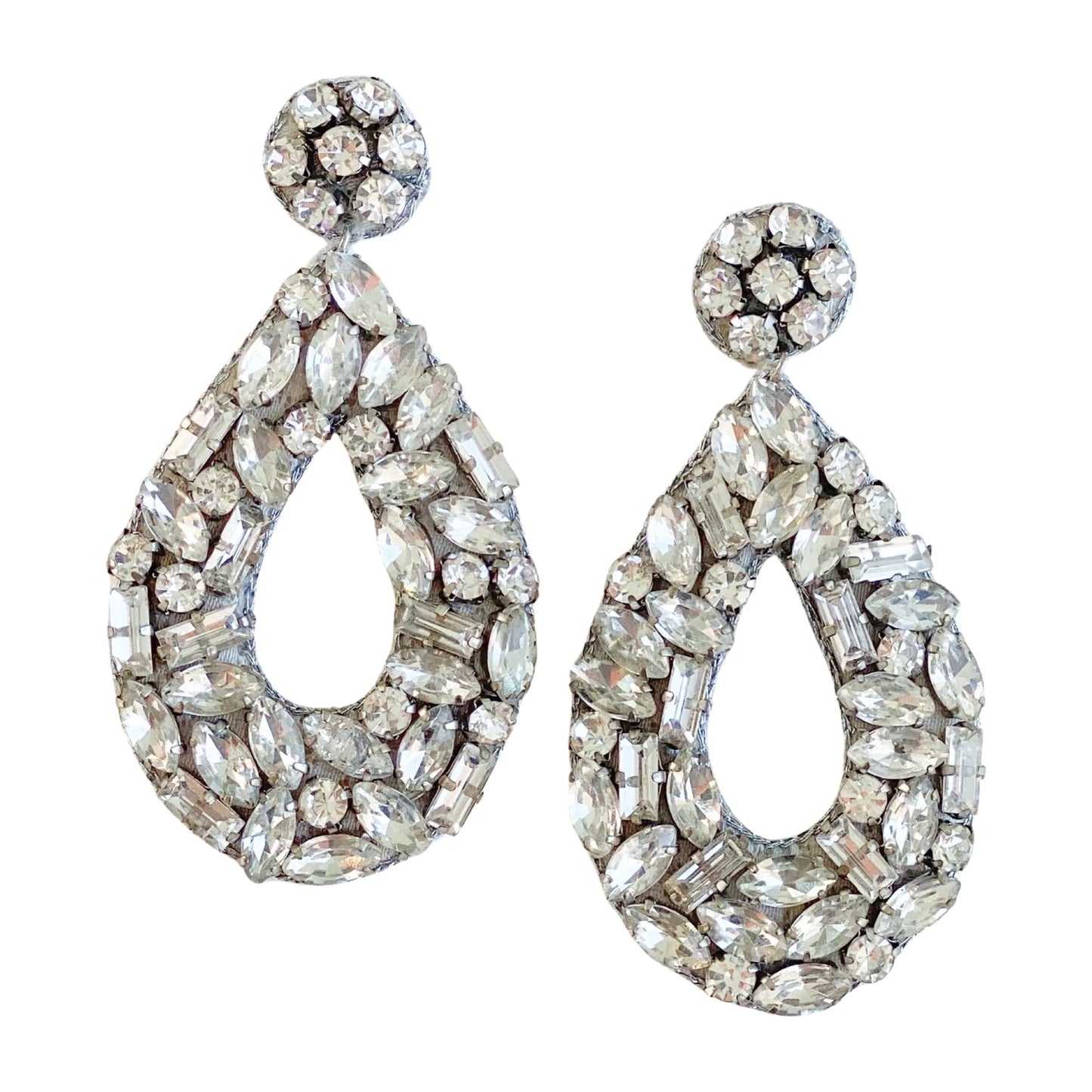 Elevate your look with the Juliet Earrings. These earrings feature glistening glass stones expertly cut into different shapes. The stones reflect the light, creating a captivating visual symphony.  They make a timeless and elegant addition to any outfit!